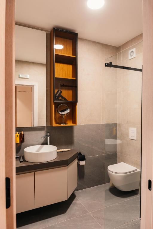 Private bathroom with walk-in shower at Hotel Nordik