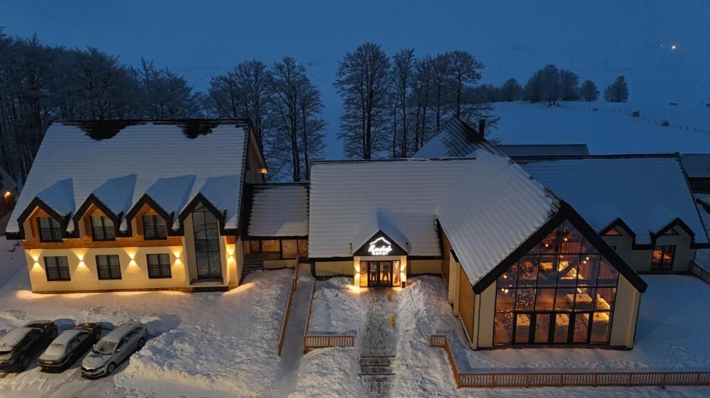 Hotel Nordik lit up on a winter evening near Žabljak